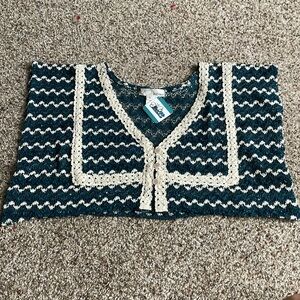 Brand new top with tags still connected. Lacy green and white top